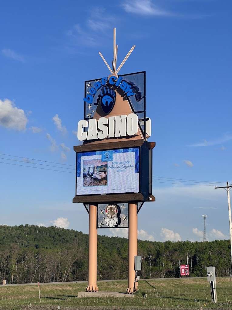 Bear Claw Casino sign against a blue prairie sky
